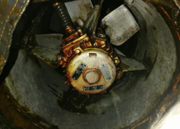 Grease impingement on a fan